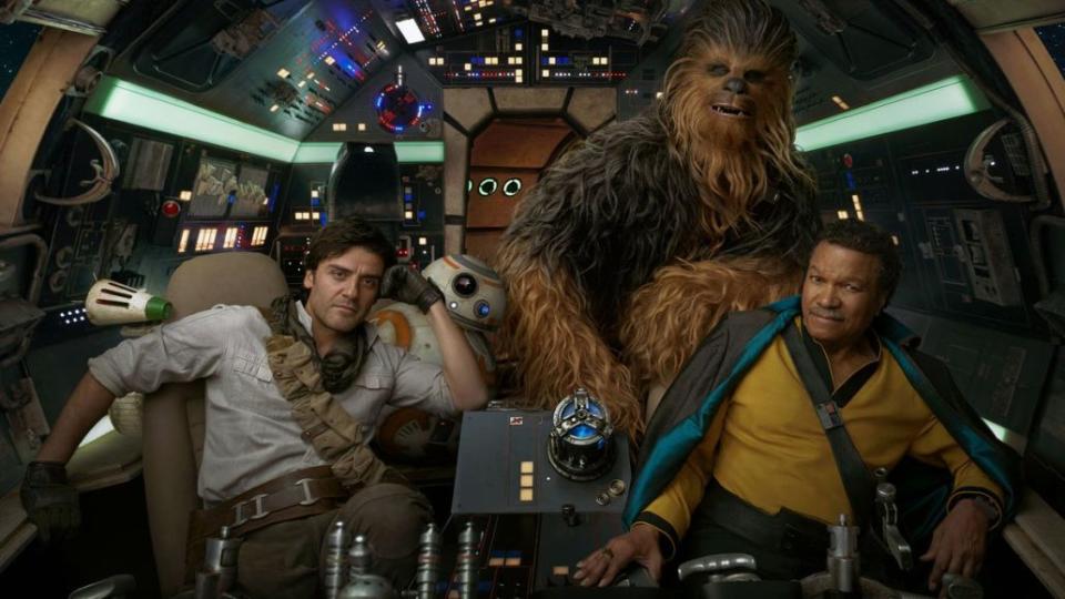 Lando Calrissian (Billy Dee Williams), Poe Dameron (Oscar Isaac), Chewbacca, D-O, and BB-8 in the Millennium Falcon in Star Wars: The Rise of Skywalker