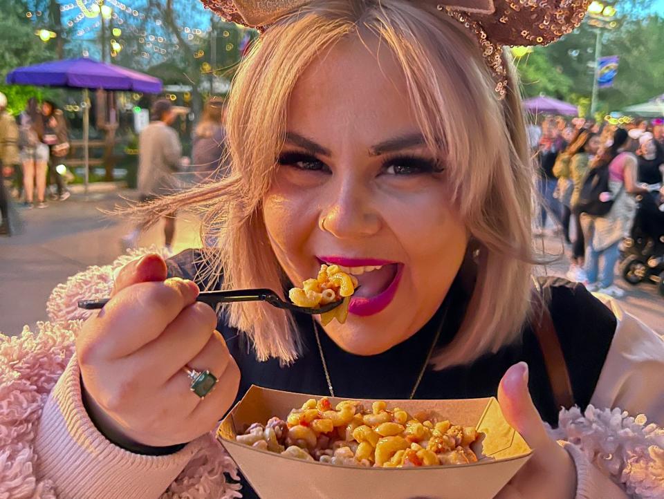 dana eating the peanut butter and jelly pasta at disneyland