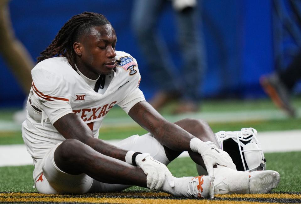 Texas Longhorns wide receiver Xavier Worthy (1) sits in the end zone after the final whistle in the Sugar Bowl College Football Playoff semi-finals at the Ceasars Superdome in New Orleans, Louisiana, Jan. 1, 2024. The Huskies won the game 37-31, knocking the Longhorns out of National Championship contention.