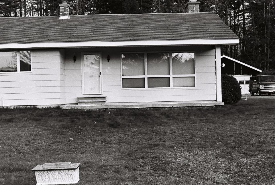 William Rew's summer home in the town of Hope, Hamilton County, pictured shortly after Karen Rew Mason's death on May 8, 1988. Mason was found dead at the steps of the screen door, which was propped open by her shoulder.