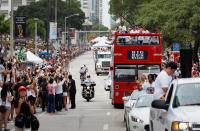 MIAMI, FL - JUNE 25: Fans cheer as the Miami Heat pass by in a victory parade through the streets during a celebration for the 2012 NBA Champion Miami Heat on June 25, 2012 in Miami, Florida. The Heat beat the Oklahoma Thunder to win the NBA title. (Photo by Joe Raedle/Getty Images)