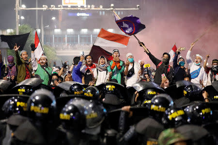 People shout during a protest outside the Election Supervisory Agency (Bawaslu) headquarters following the announcement of the last month's presidential election results in Jakarta, Indonesia, May 22, 2019. REUTERS/Willy Kurniawan