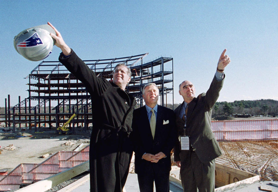 FILE - National Football League commissioner Paul Tagliabue, left, points to construction on the new New England Patriots football stadium as he examines the structure along with Patriots' owner Robert Kraft, center, and construction project director Terry McManus, right, at the site in Foxboro, Mass., in this Sunday, Nov. 19, 2000, file photo. During Tagliabue’s 17-year stint as commissioner, the NFL experienced labor peace, saw skyrocketing television deals, construction of new stadiums across the nation, and expansion to the current 32-team makeup.(AP Photo/Jim Rogash, File)