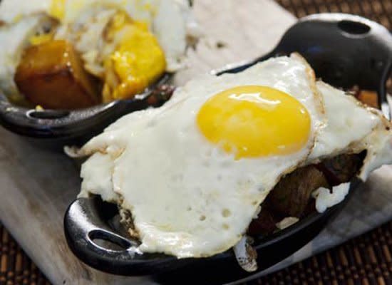 <strong>Get the <a href="http://www.huffingtonpost.com/2011/10/27/honey-roasted-potatoes-wi_n_1057260.html" target="_hplink">Honey Roasted Potatoes with Fried Eggs and Bacon recipe</a>  </strong>      