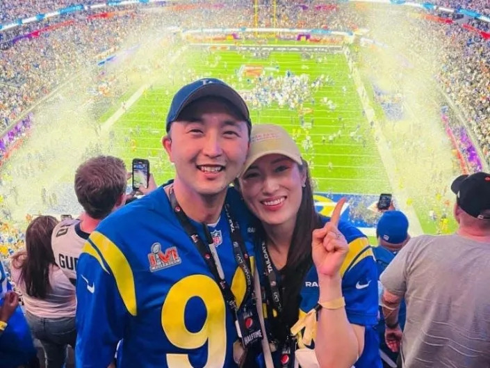 Angela Kim and her husband Howard at the Super Bowl.