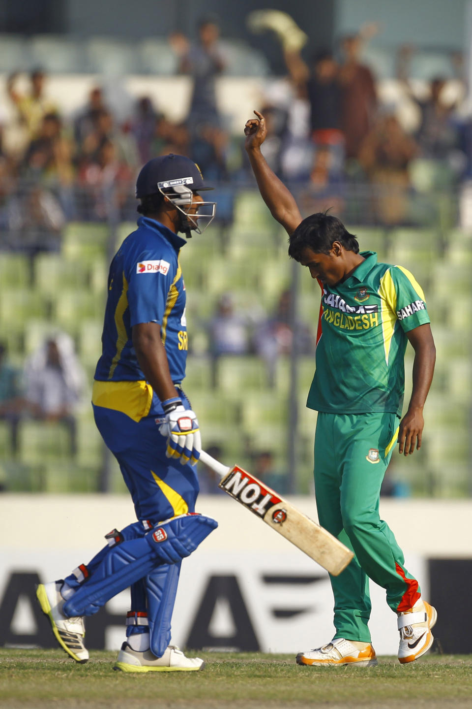 Bangladesh’s Rubel Hossain, right, celebrates the dismissal of Sri Lanka’s Thisara Perera during their second one-day international (ODI) cricket match in Dhaka, Bangladesh, Thursday, Feb. 20, 2014. (AP Photo/A.M. Ahad)