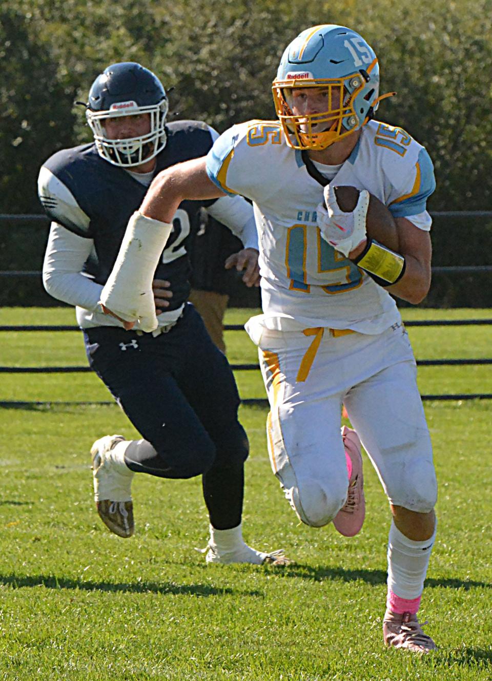 Hamlin's Evan Stormo heads upfield as Great Plains Lutheran's Myles York chases him during their high school football game on Saturday, Oct. 7, 2023 at Watertown Stadium.