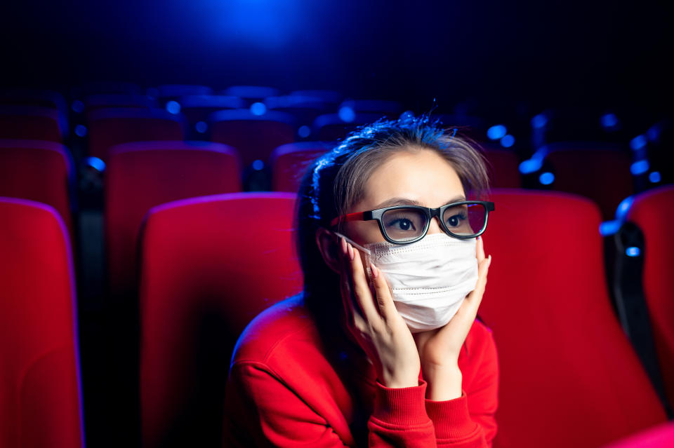 sick person cinema mask watch movie public virus asian epidemic