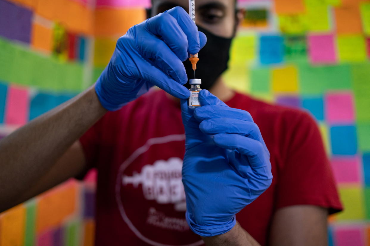 Dr. Mayank Amin draws a Pfizer-BioNTech coronavirus disease (COVID-19) children's booster vaccine at Skippack Pharmacy in Schwenksville, Pennsylvania, U.S., June 2, 2022. REUTERS/Hannah Beier