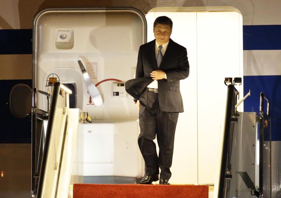 In this Nov. 15, 2018 photo, Chinese President Xi Jinping arrives at Port Moresby, Papua New Guinea. As world leaders arrive in Papua New Guinea for a Pacific Rim summit, the welcome mat is especially big for China’s President Xi Jinping. With both actions and words, Xi has a compelling message for the South Pacific’s fragile island states, long both propped up and pushed around by U.S. ally Australia: they now have a choice of benefactors.(AP Photo/Aaron Favila)