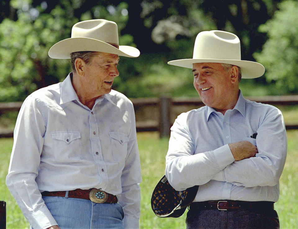 FILE - Former President Ronald Reagan, left, and former Soviet President Mikhail Gorbachev don cowboy hats while enjoying a moment at Reagan's Rancho del Cielo north of Santa Barbara, Calif, on May 2, 1992. Russian news agencies are reporting that former Soviet President Mikhail Gorbachev has died at 91. The Tass, RIA Novosti and Interfax news agencies cited the Central Clinical Hospital. (AP Photo/Bob Galbraith, File)