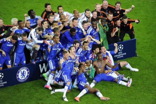 Chelsea players celebrate with the trophy after the UEFA Champions League final. Chelsea beat Bayern Munich 4-3 on penalties to win the Champions League