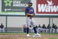 Houston Astros' Jose Altuve reacts after hitting an RBI double during the third inning of a spring training baseball game Detroit Tigers Monday, Feb. 24, 2020, in Lakeland, Fla. (AP Photo/Frank Franklin II)