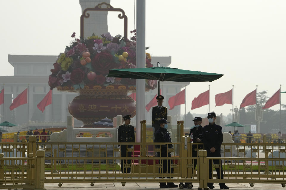 Chinese security personnel guard Tiananmen Square near the Great Hall of the People where the upcoming 20th Party Congress will be held in Beijing, Friday, Oct. 14, 2022. China's ruling Communist Party is holding its twice-a-decade national congress starting Sunday, Oct. 16, 2022. That's where President Xi Jinping is expected to receive a third five-year term as the uncontested head of the party, government and military of the world's second-largest economy. (AP Photo/Ng Han Guan)