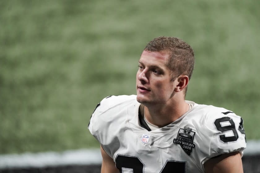 Las Vegas Raiders defensive end Carl Nassib (94) leaves the field after an NFL football game.