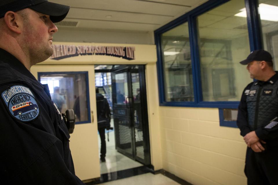 Corrections officers work in the Enhanced Supervision Housing Unit at the Rikers Island Correctional facility in New York March 12, 2015. New York City is proposing to reduce violence among inmates at its troubled Rikers Island jail by limiting visitors, adding security cameras and separating rival gangs.