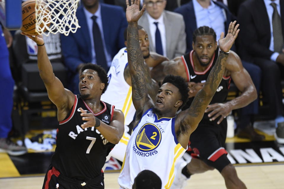 Toronto Raptors guard Kyle Lowry (7) makes a layup as Golden State Warriors forward Jordan Bell (2) defends during the first half of Game 3 of basketball’s NBA Finals, Wednesday, June 5, 2019, in Oakland, Calif. (Frank Gunn/The Canadian Press via AP)