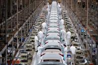 Employees work on a production line inside a Dongfeng Honda factory in Wuhan