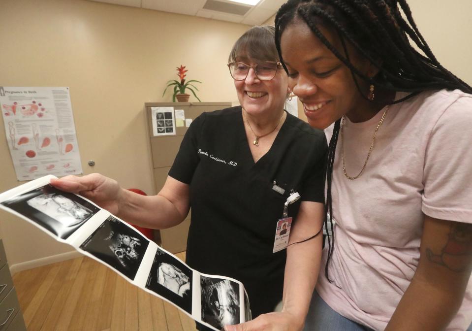 Shar Quan Baker had trouble finding a Volusia County obstetrician who would accept her Medicaid insurance plan. Last month she was able to get in as a patient at Halifax OB/GYN Associates in Daytona Beach. Baker is pictured with Dr. Pam Carbiener on May 25 looking over images from her ultrasound.