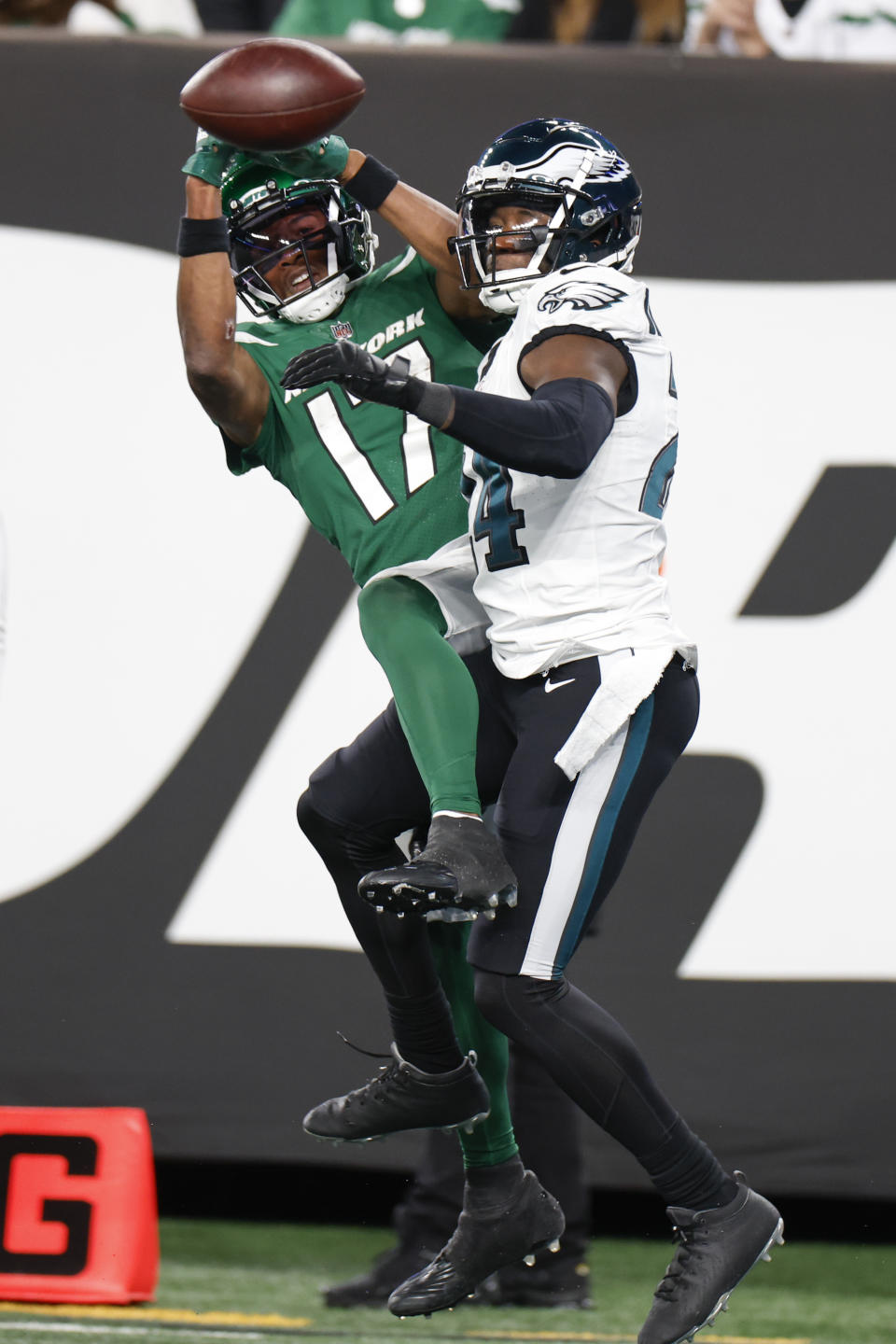 Philadelphia Eagles' James Bradberry, right, breaks up a pass intended for New York Jets' Garrett Wilson during the second half of an NFL football game, Sunday, Oct. 15, 2023, in East Rutherford, N.J. (AP Photo/Noah K. Murray)