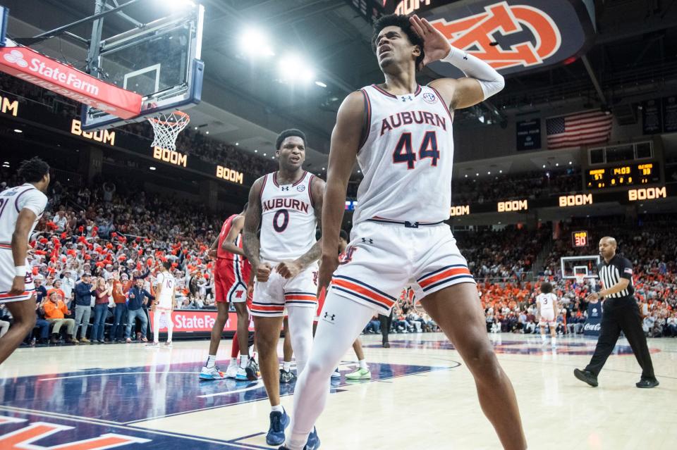 Auburn Tigers center Dylan Cardwell (44) celebrates his dunk as Auburn Tigers takes on Ole Miss Rebels at Neville Arena in Auburn, Ala., on Saturday, Jan. 20, 2024. Auburn Tigers defeated Ole Miss Rebels 82-59.