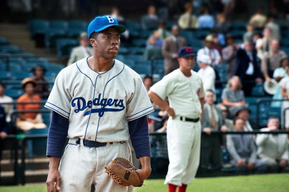 This film image released by Warner Bros. Pictures shows Chadwick Boseman as Jackie Robinson in a scene from "42." The movie, about Robinson’s, life, is bringing his inspiring story to a new generation. Fans young and old can find a number of places in Brooklyn connected to the baseball great. (AP Photo/Warner Bros. Pictures, D. Stevens)