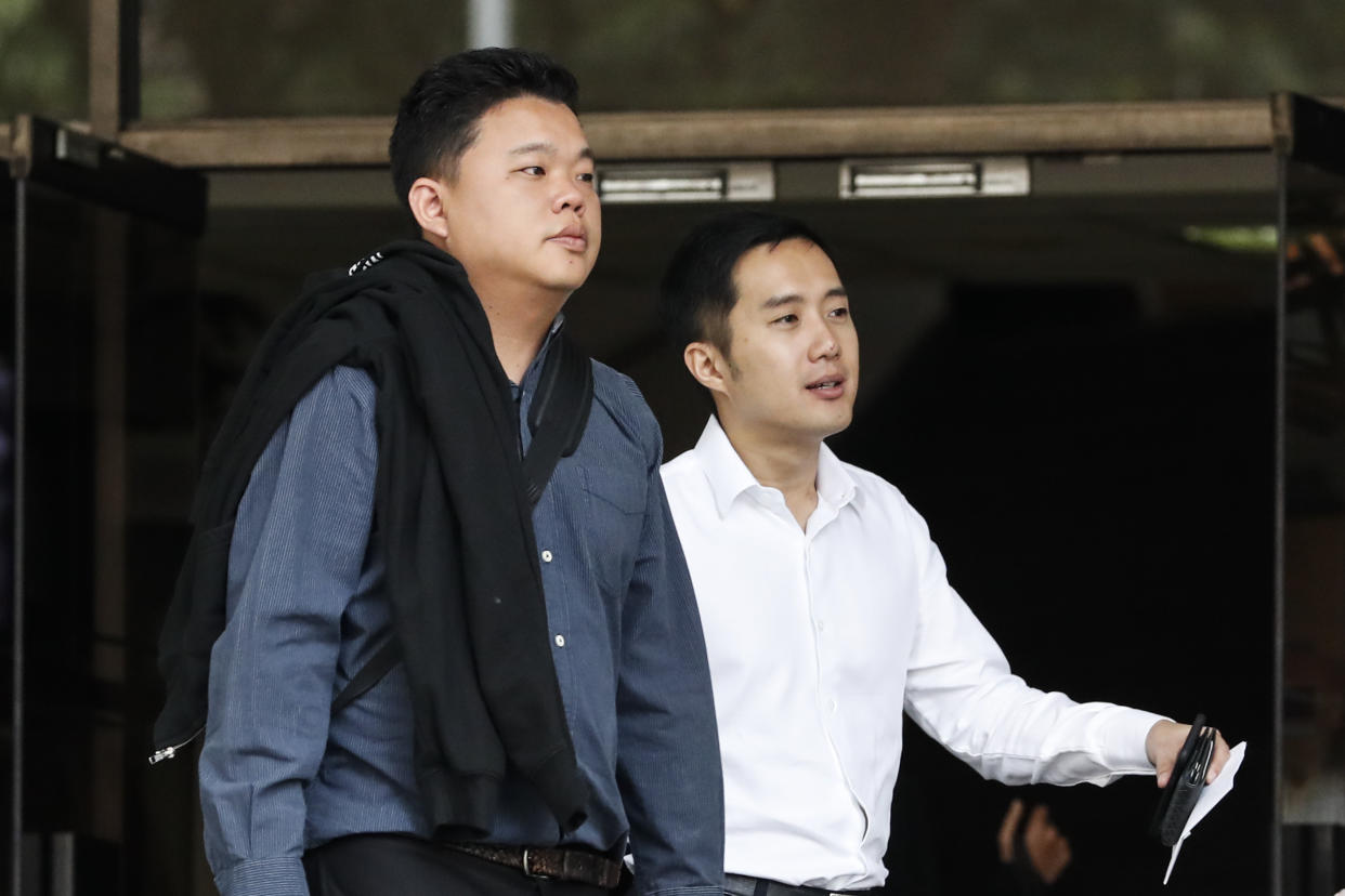 Yao Song Liang (left) and Terence Tan En Wei seen leaving the State Courts on 16 January. (AP file photo)