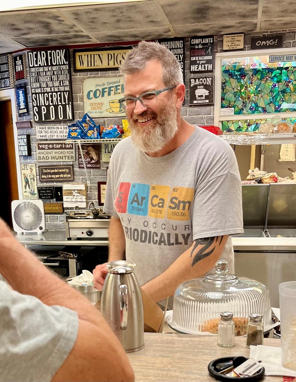 Tony Clark chats with customers a few days before the scheduled closing of Shawn & Tony's Kitchen in Fort Myers.