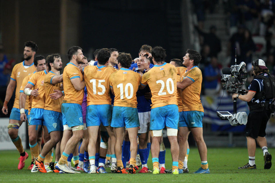 Players argue at the end of the Rugby World Cup Pool A match between Italy and Uruguay at the Stade de Nice, in Nice, Wednesday, Sept. 20, 2023. (AP Photo/Daniel Cole)