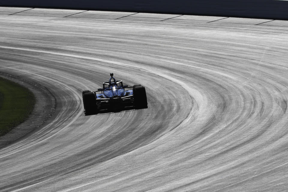 Scott Dixon, of New Zealand, drives into turn one during the Aeroscreen testing at Indianapolis Motor Speedway, Wednesday, Oct. 2, 2019, in Indianapolis. (AP Photo/Darron Cummings)