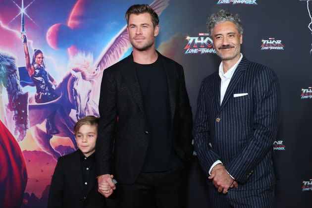 Hemsworth holds Sasha's hand while standing alongside Taika Waititi in attendance for the Sydney premiere of 