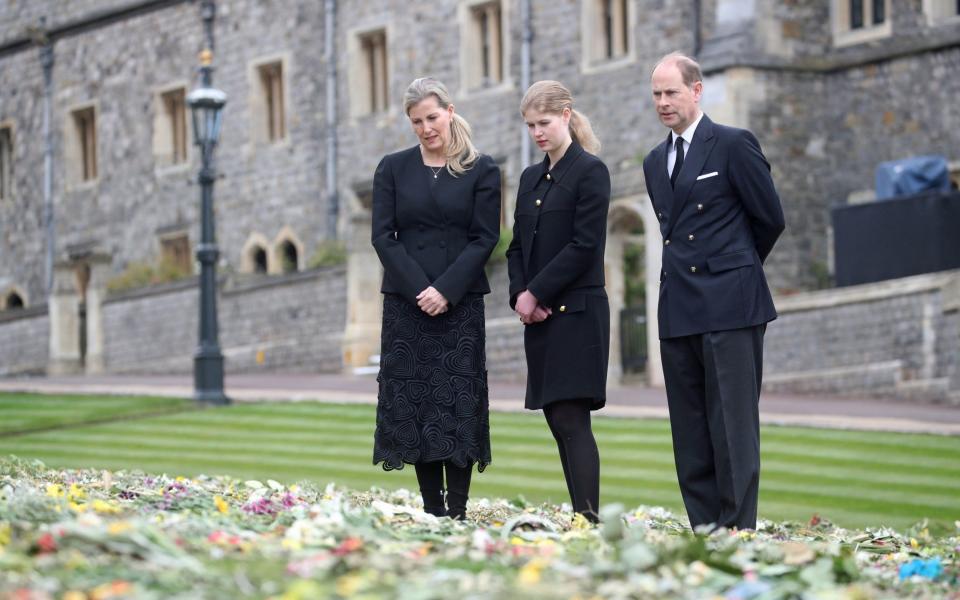 The Countess of Wessex, Lady Louise Windsor and the Earl of Wessex view flowers outside St George's Chapel, at Windsor Castle, Berkshire - Steve Parsons 