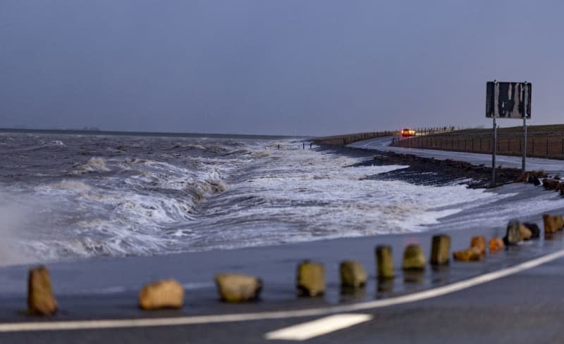 High waves break at the North Sea ferry docks in Dagebuell. Axel Heimken/dpa