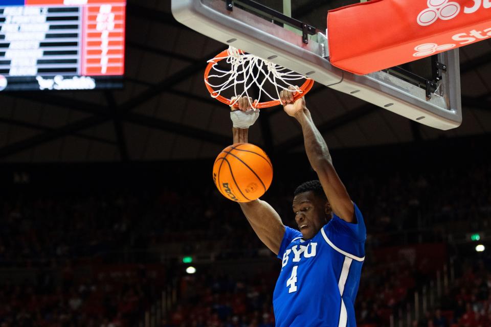 Brigham Young Cougars forward Atiki Ally Atiki (4) dunks the ball during a men’s basketball game against the Utah Utes at the Jon M. Huntsman Center in Salt Lake City on Saturday, Dec. 9, 2023. | Megan Nielsen, Deseret News