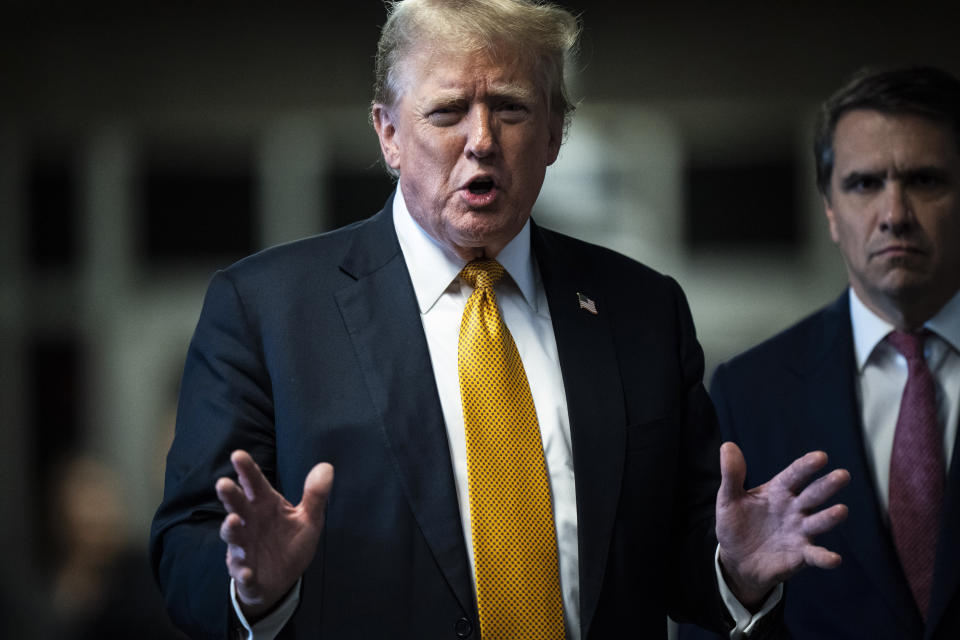 Former President Donald Trump speaks to reporters with his attorney Todd Blanche, right, as jurors begin deliberations for his trial at Manhattan criminal court, Wednesday, May 29, 2024, in New York. (Jabin Botsford/The Washington Post via AP, Pool)