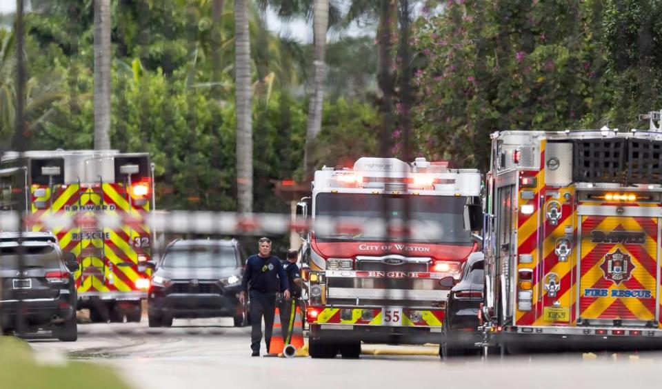 First responders work an active fire inside the Landmark Ranch Estates neighborhood on Wednesday, Jan. 3, 2023, in Southwest Ranches, Fla. Davie Fire Rescue crews alongside the Broward Sheriff’s Office worked to put out a two-alarm fire at a home belonging to Miami Dolphins wide receiver Tyreek Hill inside the gated community.