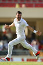 <p>James Anderson of England claims the wicket of Denesh Ramdin to pass Ian Botham’s record of 383 in April 2015 </p>