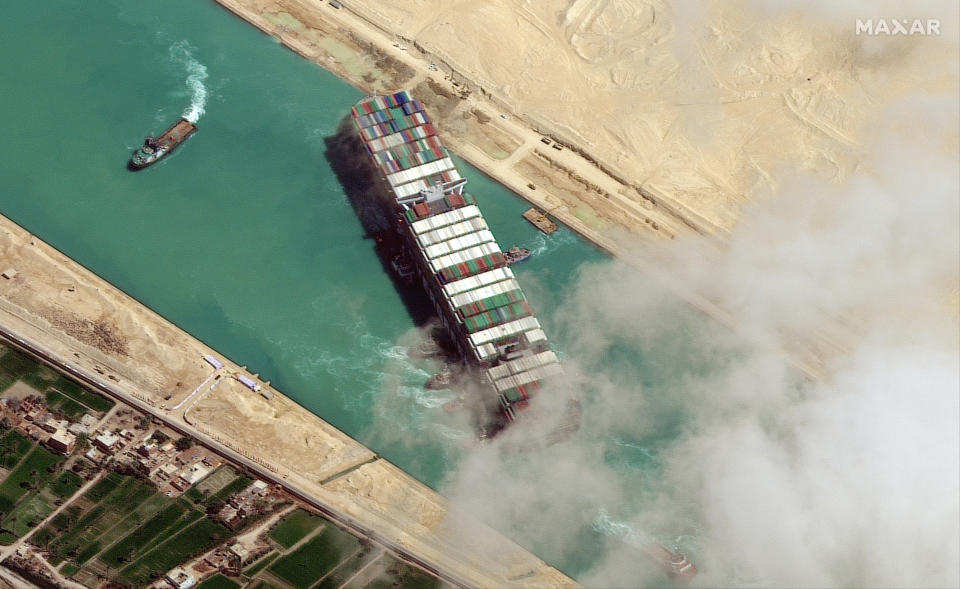 STUCK SHIP EVER GIVEN, SUEZ CANAL -- MARCH 29, 2021:  Maxar new high-resolution satellite imagery of the Suez canal and the container ship (EVER GIVEN) that remains stuck in the canal north of the city of Suez, Egypt.  Please use: Satellite image (c) 2020 Maxar Technologies.