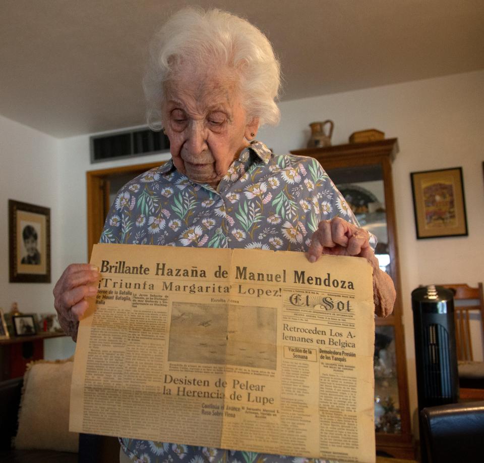 Marguerite Trujillo holds a Spanish newspaper that has her name printed at the top as "¡'Triunta Margarita' Lopez!" at her home in Phoenix on June 30. She's well known in the local Latino community for having been one one of the few women working in an office in the 1930s.