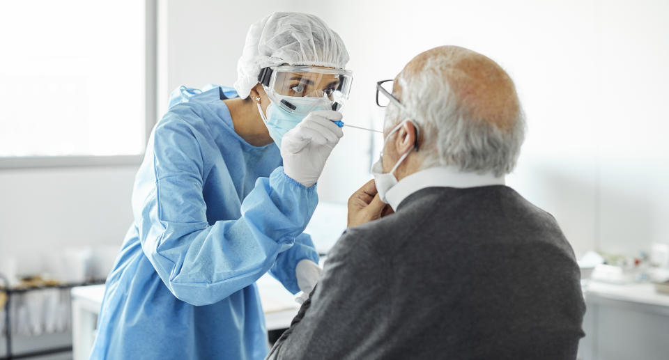 A man receives is Covid test by a medical professional