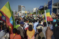 Ethiopians holding national flags protest against what they say is interference by outsiders in the country's internal affairs and against the Tigray People's Liberation Front (TPLF), the party of Tigray's fugitive leaders, at a rally organized by the city administration in the capital Addis Ababa, Ethiopia Saturday, Oct. 22, 2022. The demonstrations were staged ahead of the expected start of peace talks in South Africa next week between the warring parties, with the U.S. saying Friday it supports the African Union's efforts to mediate talks to stop fighting in Tigray. (AP Photo)