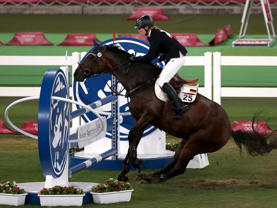 Annika Schleu of Germany in action in the modern pentathlon at the Tokyo Olympics