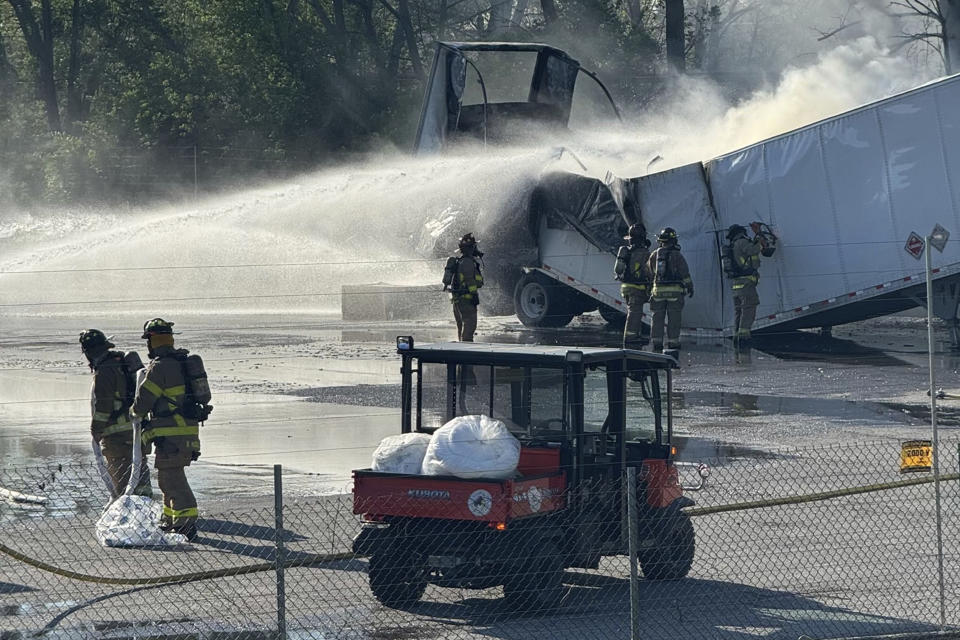 This photo released by the Columbus Fire Department shows firefighters tending to a fire that began on a trailer carrying lithium batteries in Columbus, Ohio on Thursday, April 18, 2024. (Columbus Fire Department via AP)