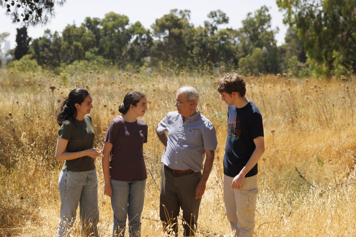 Hasan Khalidi stands on the plot with his children Muna, Lynne and Ragheb.  (Kobi Wolf for NBC News)