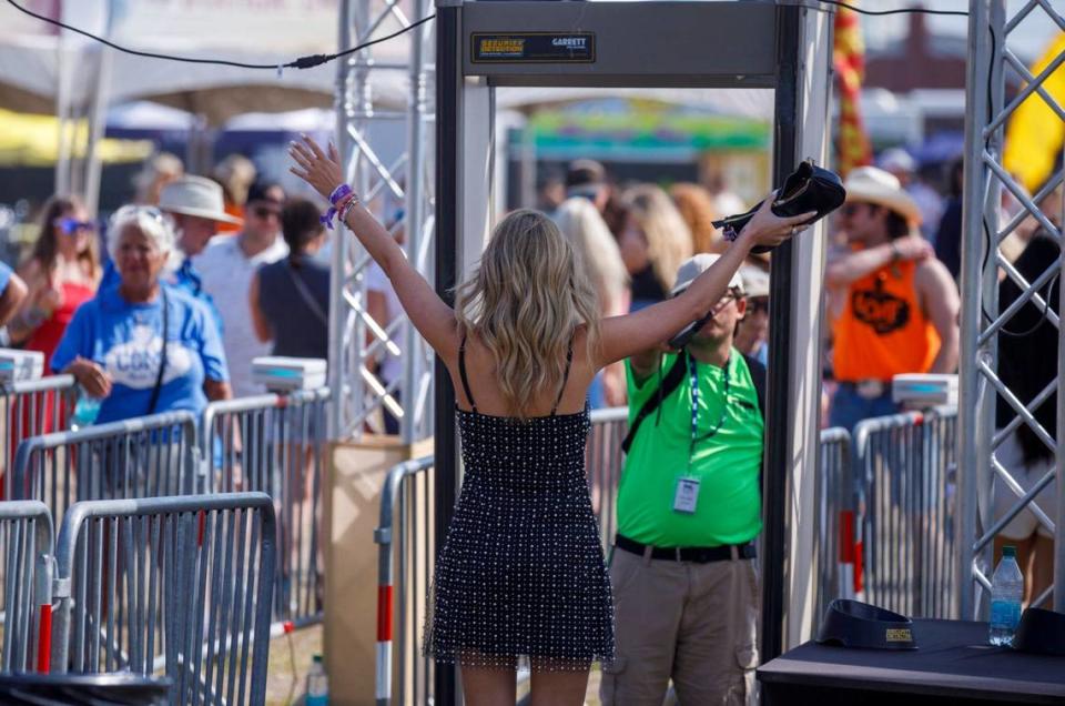 Attendees pass through security checkpoints on the way in to Carolina Country Music Fest. Country music fans arrive for the first night Carolina Country Music Fest 2024. The four day event is expected to draw 30,000 each night at the Burroughs and Chapin Pavilion Place in Myrtle Beach, S.C. Thursday, June 6, 2024.