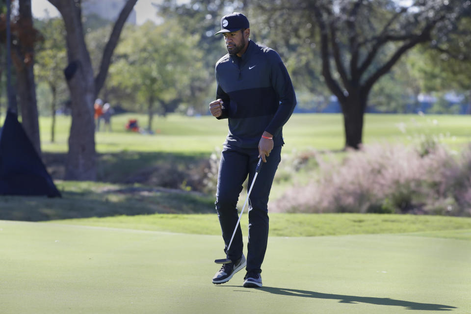 Tony Finau reacts after sinking his putt on the eighth green for a birdie, putting him at 14-under par for the tournament, during the third round of the Houston Open golf tournament, Saturday, Nov. 12, 2022, in Houston. (AP Photo/Michael Wyke)