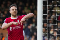 Liverpool's Diogo Jota celebrates after scoring his side's third goal during the English Premier League soccer match between Fulham and Liverpool at Craven Cottage stadium in London, Sunday, April 21, 2024. (AP Photo/Kirsty Wigglesworth)