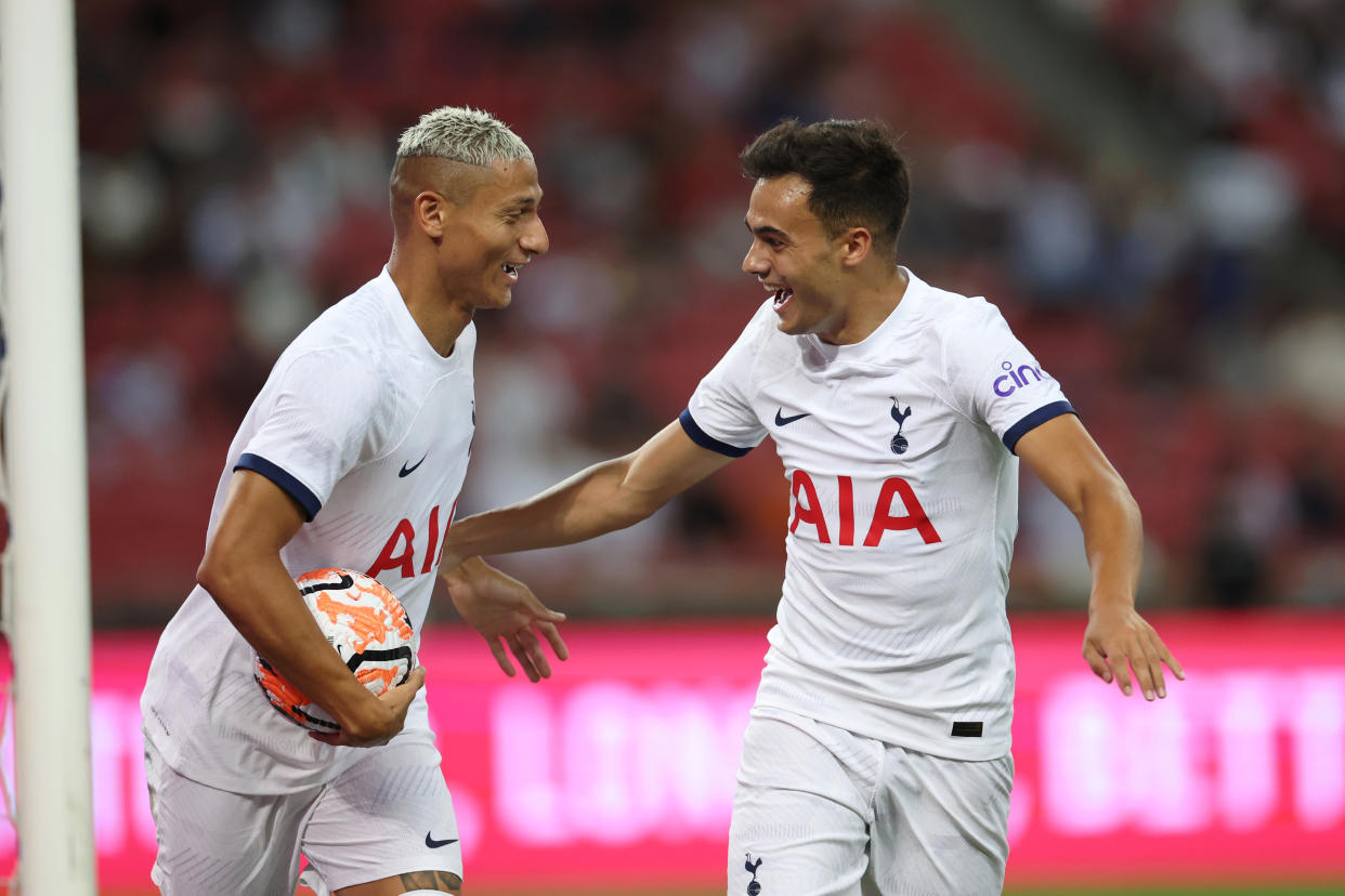 Tottenham scorers Richarlison (left) and Giovani lo Celso celebrate during their pre-season friendly match against Lion City Sailors at the National Stadium in Singapore.