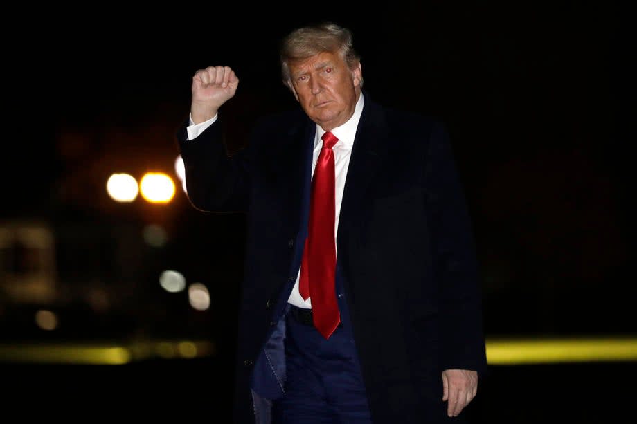 President Trump gestures while walking on the South Lawn of the White House upon his return to Washington DC on 12 December 2020. (EPA-EFE)