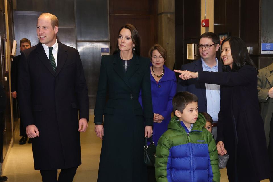 BOSTON, MASSACHUSETTS - NOVEMBER 30: Prince William, Prince of Wales and Catherine, Princess of Wales pose with Mayor Michelle Wu and Conor Pewarski to kick off Earthshot celebrations by lighting up Boston at Speaker’s Corner by City Hall on November 30, 2022 in Boston, Massachusetts. The Prince and Princess of Wales are visiting the coastal city of Boston to attend the second annual Earthshot Prize Awards Ceremony, an event which celebrates those whose work is helping to repair the planet. During their trip, which will last for three days, the royal couple will learn about the environmental challenges Boston faces as well as meeting those who are combating the effects of climate change in the area. (Photo by Chris Jackson/Getty Images)